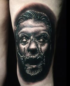 a man with a creepy face on his leg