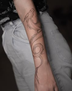 a person with a tattoo on their arm