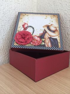 an open box with a flower on it