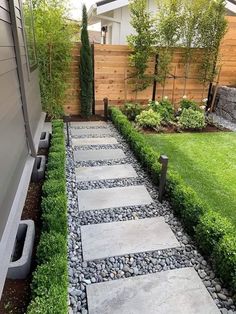 a stone path in the middle of a yard