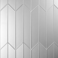 a white tiled wall with some lines on it