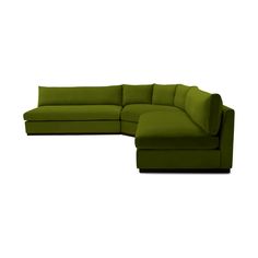 a green sectional couch with pillows on the top and bottom, sitting in front of a white background