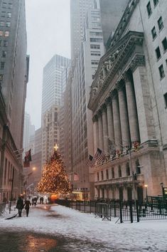 a large christmas tree in the middle of a city street