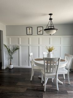 a white table and chairs in a room