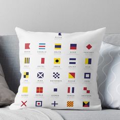 a throw pillow with different flags on it