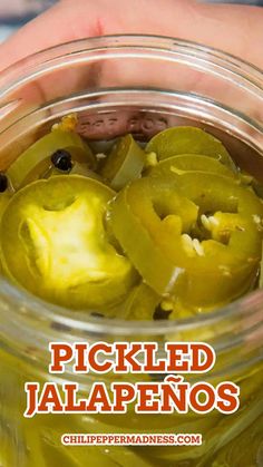 pickled jalapenos in a glass jar with text overlay that reads pickled jalapenos