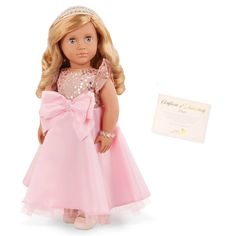 a doll with blonde hair wearing a pink dress and a tiara next to a card