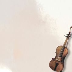 an old violin hanging on the wall in front of a white background with water droplets