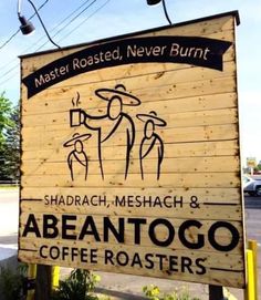 a wooden sign that says,'abantogo coffee roasters'on it