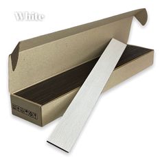 an open cardboard box with a piece of white paper sticking out of the inside of it