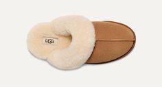 UGG™ Scuffette II Chestnut Women's House Slipper Our essential house slipper is cast in soft suede and our signature sheepskin. It's like therapy for your feet. This product was made in a factory that supports women in our supply chain with the help of HERproject. This collaborative initiative creates partnerships with brands like ours to empower and educate women in the workplace. Suede upper Sheepskin collar 17mm sheepskin lining 17mm sheepskin insole Molded rubber outsole Polyester binding or Cozy Indoor Suede Slippers, Cozy Brown Sheepskin Slippers, Women In The Workplace, Boot Jewelry, Work Boots Men, Woven Labels, House Slippers, Real Fur, Supply Chain