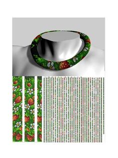 a green and red necklace with flowers on it, next to two strips of white paper