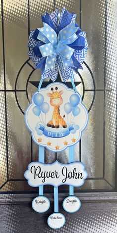 a blue and white sign with a giraffe on it that says, i'm a boy