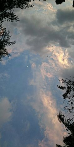 the sky and clouds are reflected in the water