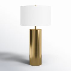 a gold lamp with a white shade on it