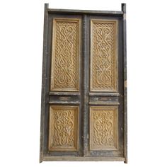 an old wooden door with intricate carvings on it