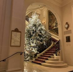 a christmas tree in the middle of a staircase