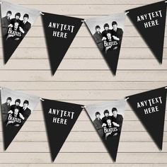 three black and white pennants with the beatles on them