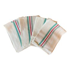 four striped napkins on top of each other