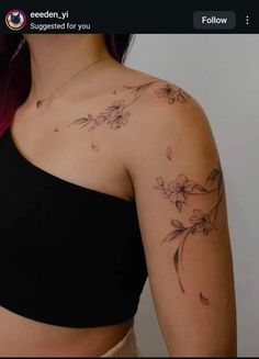 a woman's shoulder with flowers on it