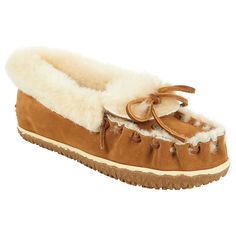 Minnetonka® Ultimate Sheepskin Suede Slipper  Meet the Minnetonka® Ultimate Sheepskin Suede Slipper, an exceptionally fluffy pair of indoor/outdoor slippers revived from the archives for the ultimate cozy experience. These head-turners feature a luxuriously soft sheepskin interior and trim, perfect for keeping your feet warm and stylish. With a suede upper, whipstitched toe, and rawhide lace, these slippers blend classic craftsmanship with modern comfort. They fit true to size, but if you're in Brown Sheepskin Slippers With Round Toe, Winter Brown Sheepskin Slippers, Classic Sheepskin Slip-on Slippers, Soft Sheepskin Slip-on Slippers, Sheepskin Slip-on Slippers With Rubber Sole, Indoor Outdoor Slippers, Fashion Shoes Flats, Outdoor Slippers, Suede Slippers