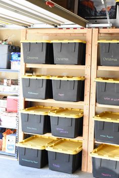 storage bins are stacked on wooden shelves in a store with the words christmas written on them