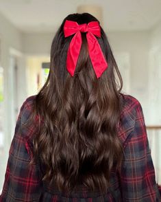 Woman with gorgeous half-up wavy hairstyle and a velvet bow. Get ready for the holidays with these 10 gorgeous holiday hairstyles! From Christmas hair inspo to chic ponytails, curls, and festive hair ideas, these looks are perfect for any celebration. Whether you need last-minute glam or creative hair ideas, you'll love these trending styles! 🎀✨ #HolidayHairstyles #ChristmasHair #HairInspo #HairIdeas #FestiveLooks