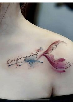 a woman with a tattoo on her chest that says, love is forever and an abstract flower