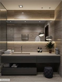 a bathroom with a sink, mirror and towel rack in it's center area