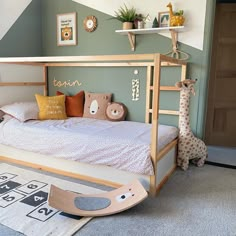 a child's bedroom with a bunk bed and toy giraffes on the floor