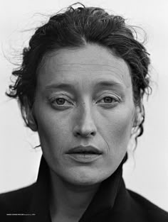 an old black and white photo of a woman with freckles on her face