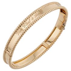 This gorgeous Van Cleef & Arpels from the classic Perlee Signature collection is crafted in 18k yellow gold and accented with a beaded border and Van Cleef & Arpels inscriptions. Made in France circa 2020s. Measurements: 0.31" (8mm) width, 6.75" (17.1cm) length. Pre-owned. Shows some normal signs of wear. Comes with VCA box. Van Cleef Arpels Perlee, Van Cleef & Arpels, Van Cleef And Arpels, Bracelet Box, Van Cleef Arpels, Van Cleef, Signature Collection, Arm Band, Bangle Bracelets