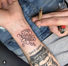 two people with matching tattoos on their arms