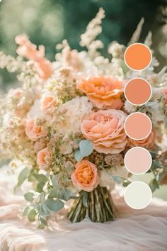 an arrangement of flowers and greenery on a table with color swatches in the background