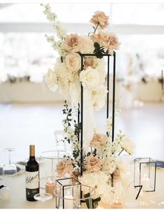 an elegant centerpiece with flowers and candles