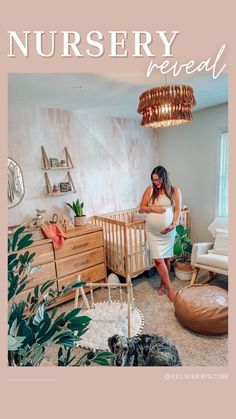 a pregnant woman standing next to a baby crib in a room with plants and furniture