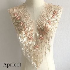 the back of a dress with flowers on it