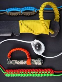 several different types of cords and tools laid out on top of each other, including a pair of scissors