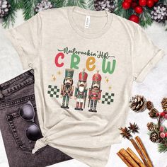 Introducing our Christmas HR T-shirt - a delightful blend of professionalism and holiday cheer for your HR team! Crafted from soft, breathable fabric, this shirt brings comfort and style to your festive workplace endeavors. Adorned with whimsical Nutcracker-design, this shirt provides infusing joy and camaraderie into your seasonal work attire.  Whether you're tackling year-end tasks or orchestrating a workplace winter wonderland, our cute Christmas HR t-shirt embodies the perfect harmony of comfort and holiday spirit. Elevate your HR team's festive flair and celebrate the season with our Nutcracker HR Crew Shirt - where work meets whimsy! * 100% combed and ring-spun cotton (Heather colors contain polyester) * Fabric weight: 4.2 oz./yd.² (142 g/m²) * Pre-shrunk fabric * Side-seamed constru Nutcracker Shirt, Seasonal Work, Staff Appreciation Gifts, Staff Appreciation, Crew Shirt, Cute Christmas, Human Resources, Work Attire, Christmas Shirt