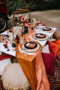 the table is set with place settings for dinner