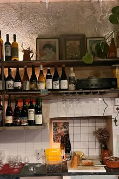 a kitchen filled with lots of bottles of wine