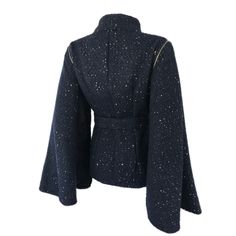 * Amazing design that can be worn 2 ways * Fitted Jacket with detachable cape style sleeves - can be worn as sleeveless jacket/vest * Beautiful black and navy woven boucle fabric with pewter colored sequins * Gold zipper details on sleeves * Fully lined * Button closure on front * Matching Waist belt with button closure Available Sizes: * Sizes: XS- XL * Sleeve Length: 25 inches * Buttons MAY vary due to availability *** Please allow up to 1 week for item to be completed. *** Detachable Cape, Cape Style, Fitted Jacket, Pewter Color, Cape Sleeves, Boucle Fabric, Jacket Vest, Sleeveless Jacket, Gold Sequins