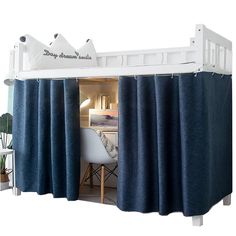 there is a bunk bed with curtains on it