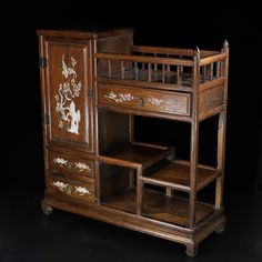 an old wooden dresser with drawers on it's sides and painted designs on the doors