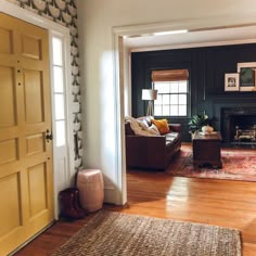 the living room is clean and ready to be used as a den or home office