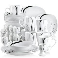 a white and black dinnerware set is shown