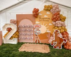 an image of a birthday party with balloons and decorations in the shape of horses on display