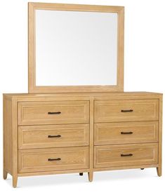 a wooden dresser with a mirror on top and drawers below it, in front of a white background