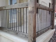 a wooden and metal railing on the side of a building