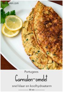 two pancakes on a white plate with lemon wedges and parsley in the background